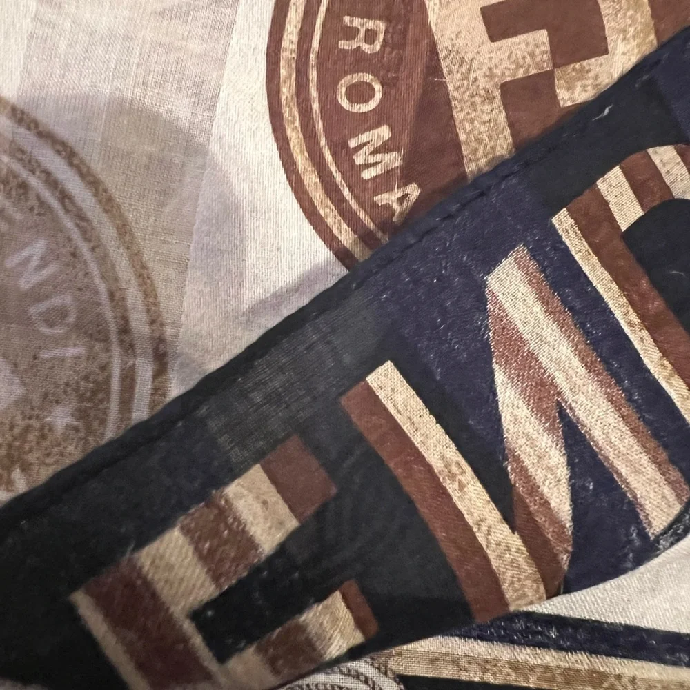 Fendi scarf 23 x 22.5” spend $400 get a free designer scarf valves at $400.